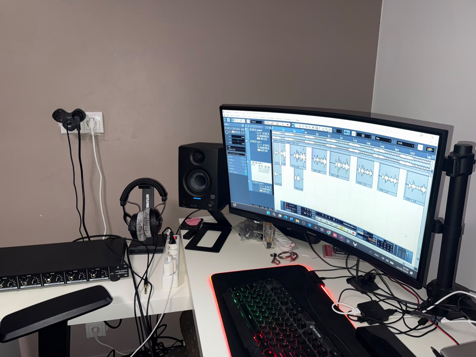 Audio production workstation with monitor, speakers and MIDI keyboard