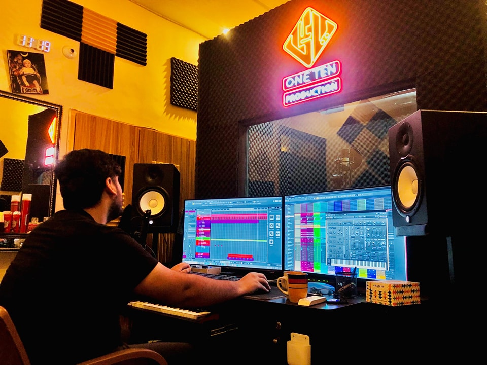 Audio engineer mixing a One Ten Production session